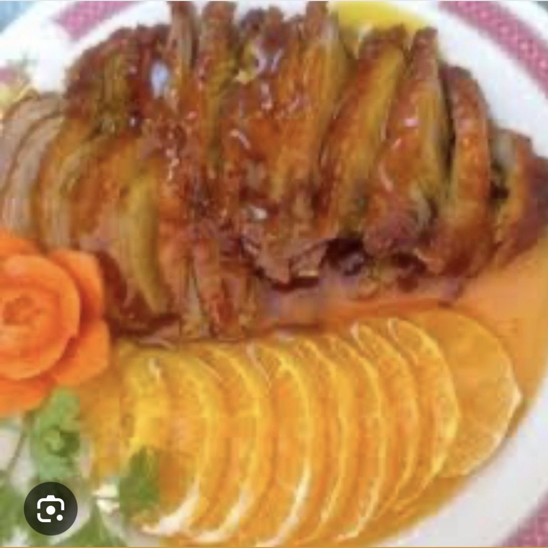Pato con salsa de naranja